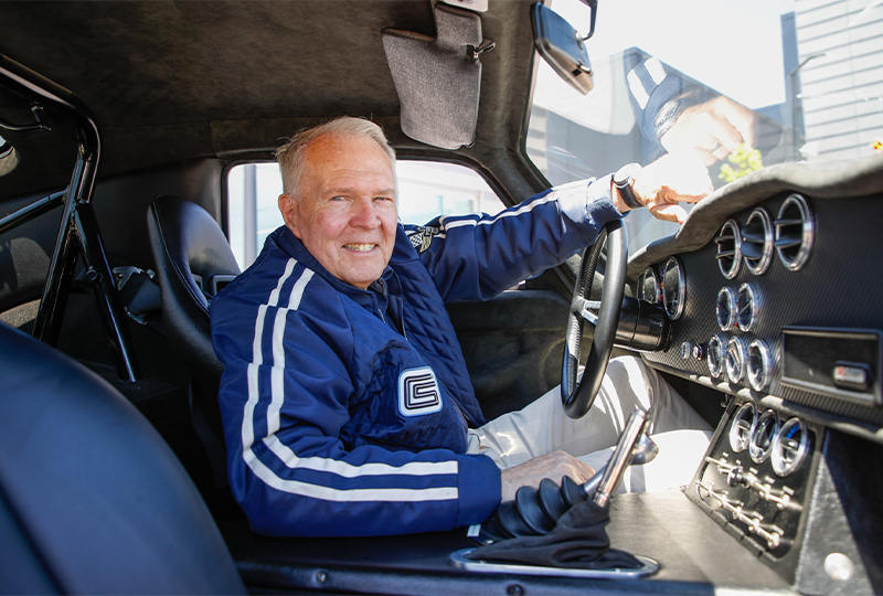 Peter Brock smiling behind the wheel